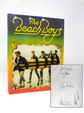 Load image into Gallery viewer, A first edition book signed by members of the Beach Boys