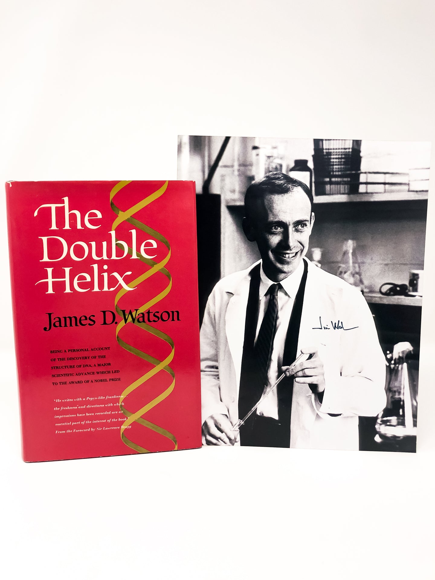A first edition of The Double Helix together with a photograph signed by James Watson