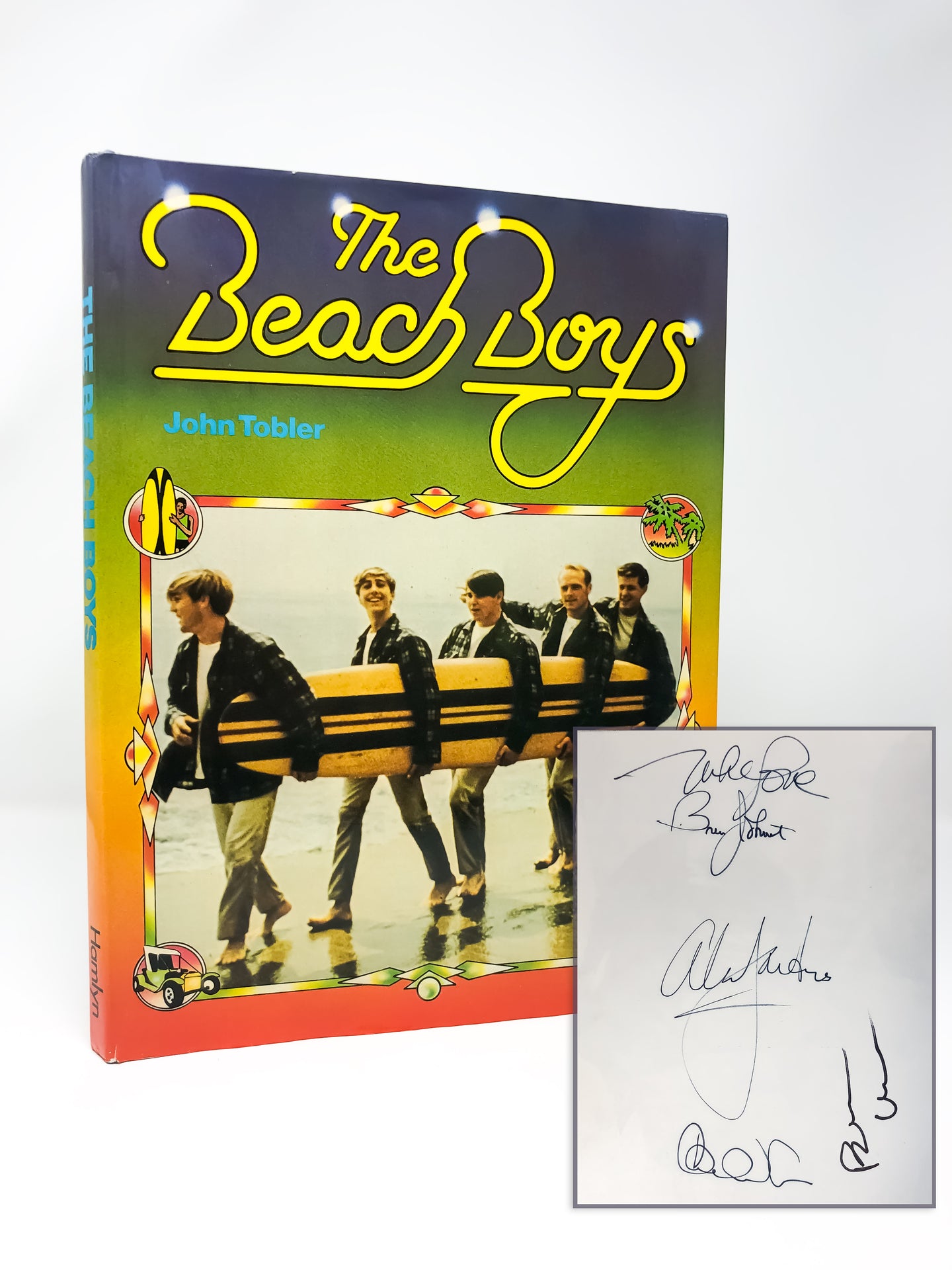 A first edition book signed by members of the Beach Boys