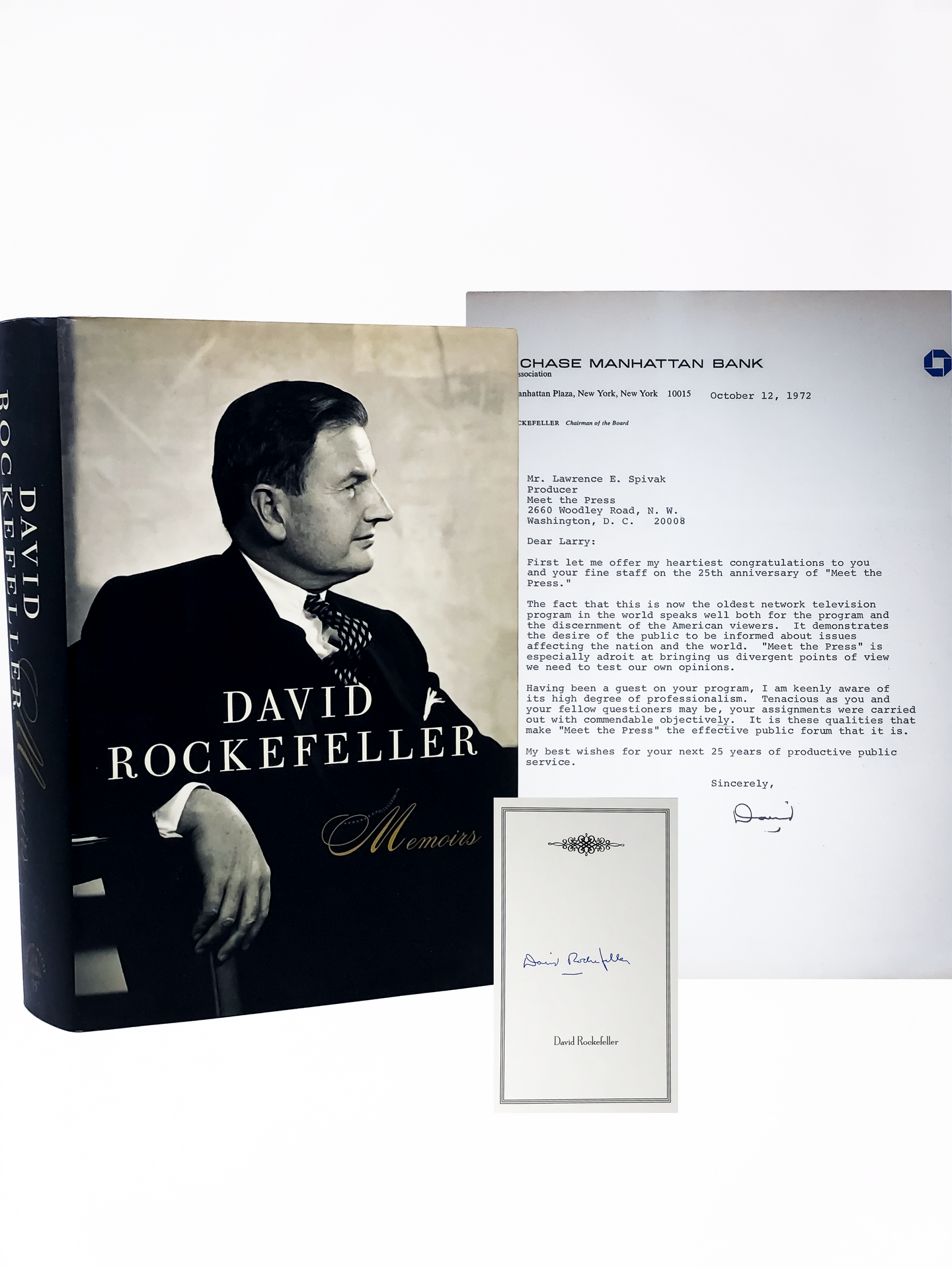 A first edition of Memoirs and a Chase Bank document both signed by David Rockefeller
